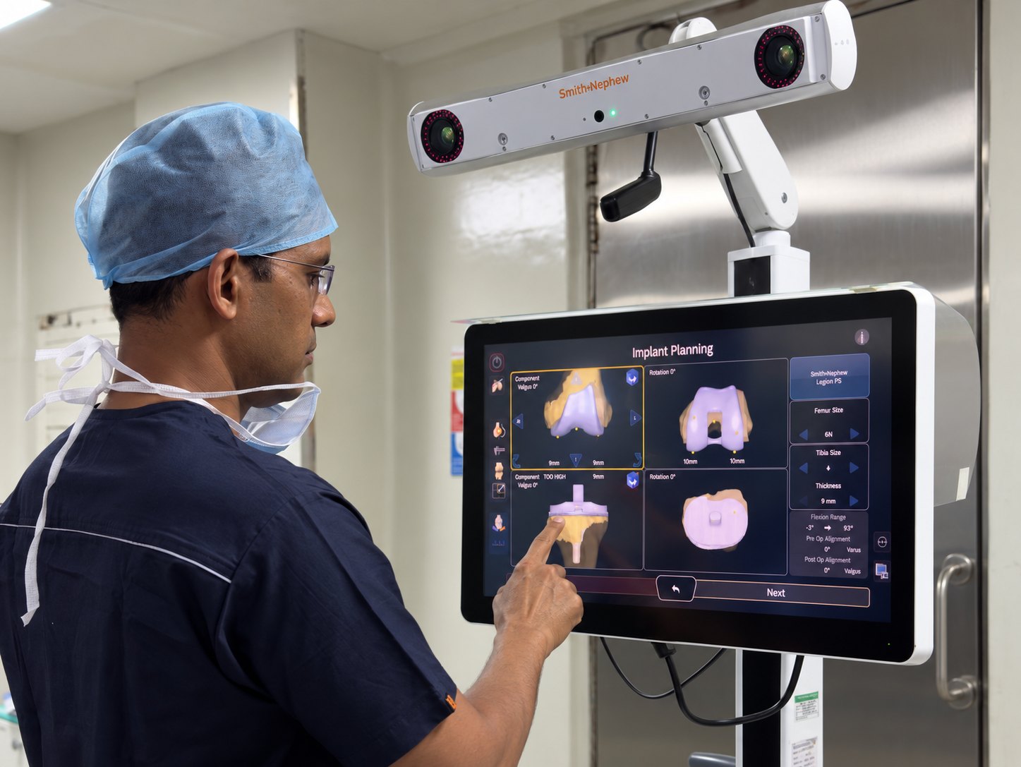 A genuine photograph of Dr. Aniket Patil using a robotic knee replacement system